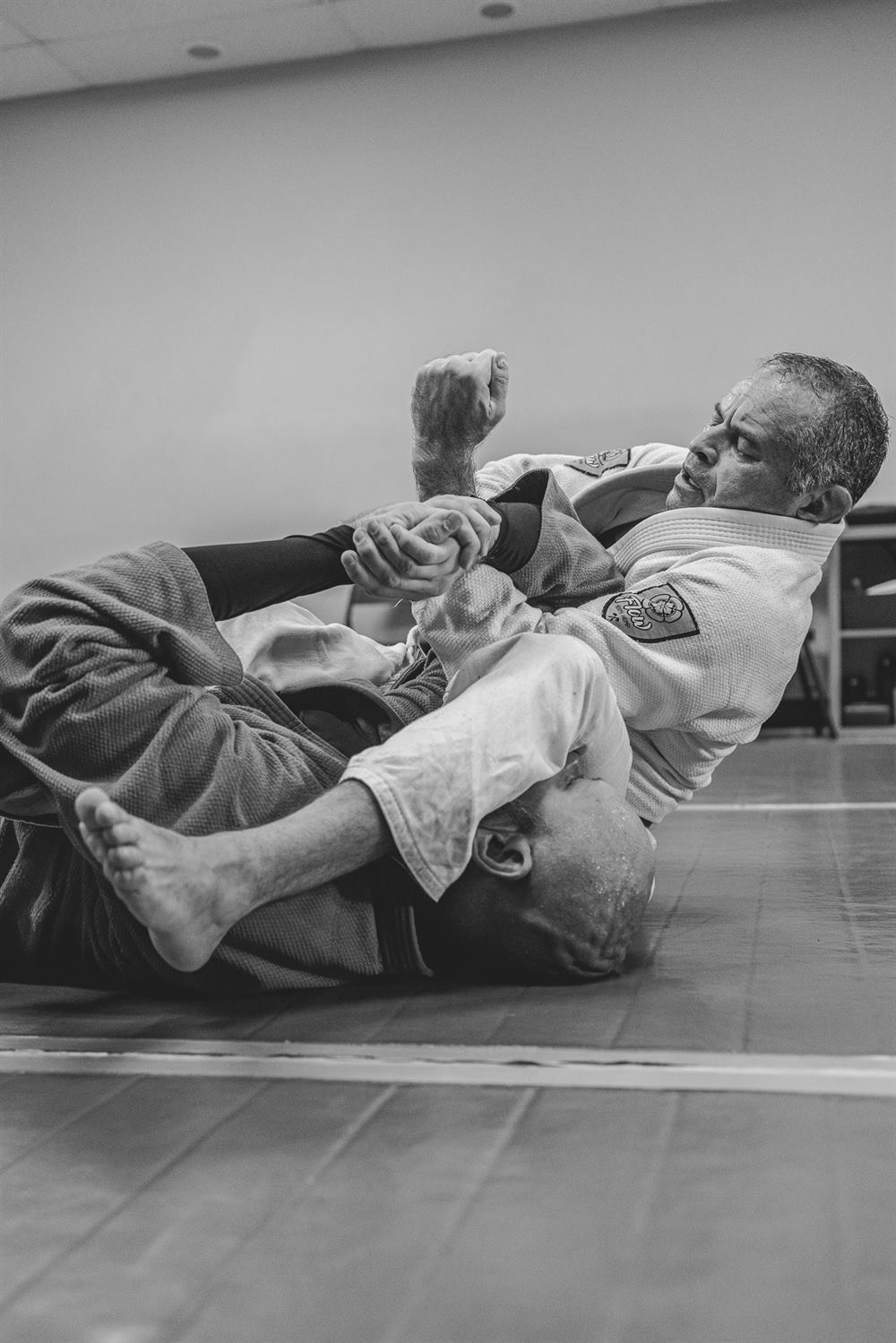 Students working ground control during Jiu-Jitsu class