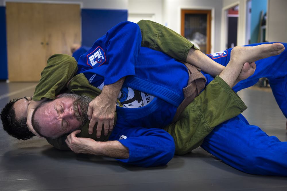 An instructor coaching a self-defense technique at Tampa Jiu-Jitsu
