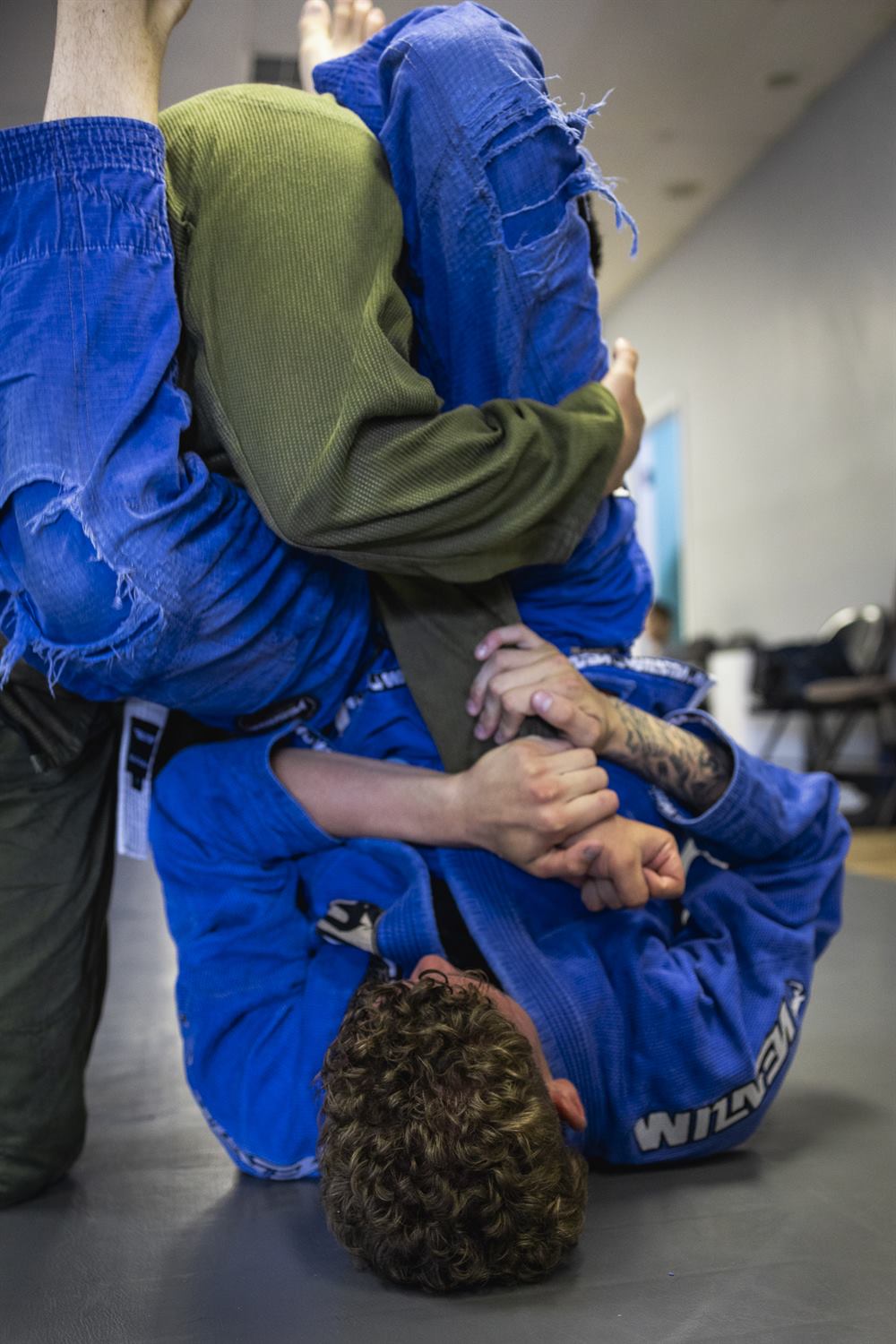 Two adult students grappling during Jiu-Jitsu class