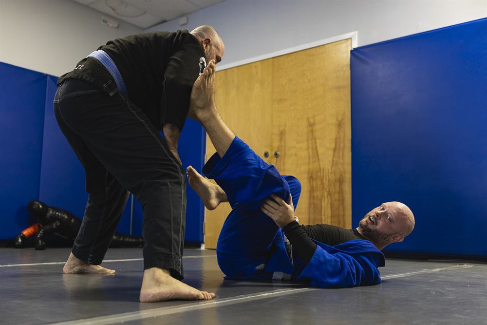 Adult students working stand-up grips during Jiu-Jitsu class