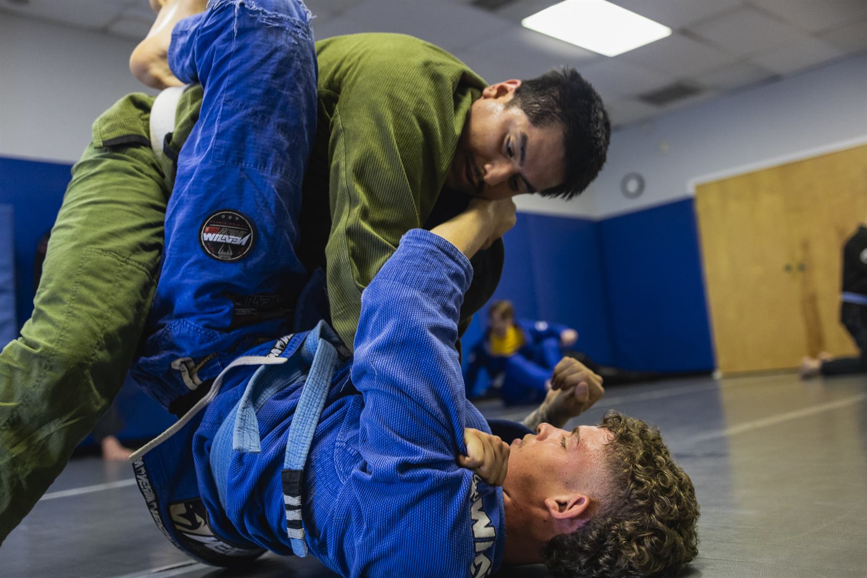 Two students rolling during Gracie Jiu-Jitsu training at Tampa Jiu-Jitsu